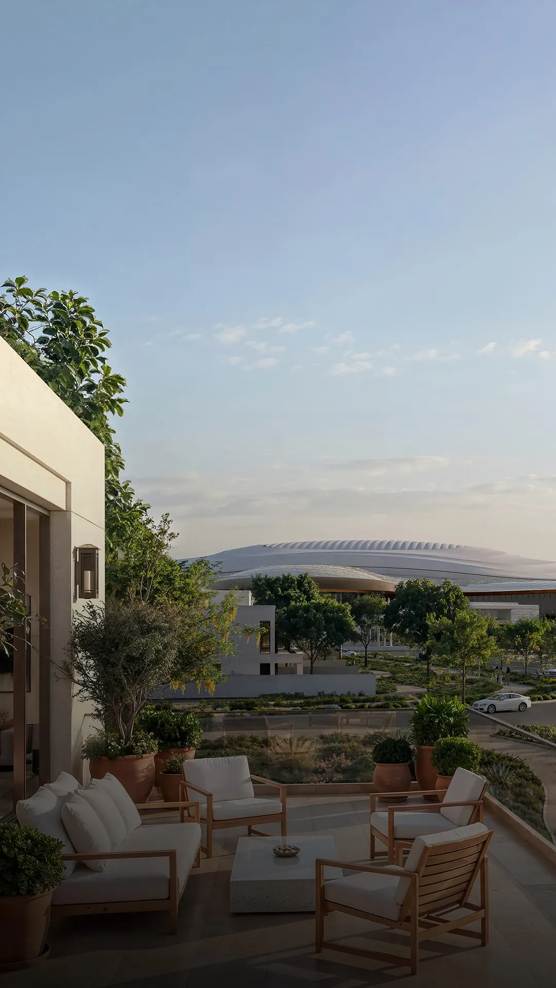 Villa terrace at Wadeem Gardens overlooking landscaped gardens and the arena on Hudayriyat Island